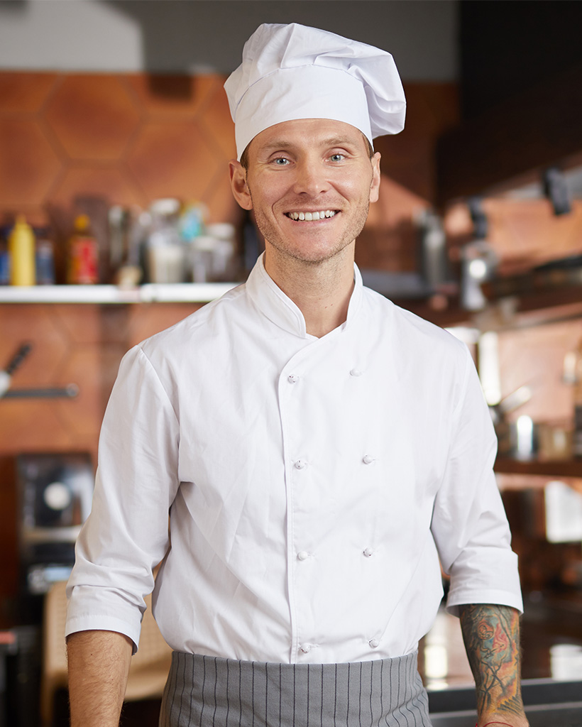 waist-up-portrait-of-handsome-professional-chef-ZM3XRA9